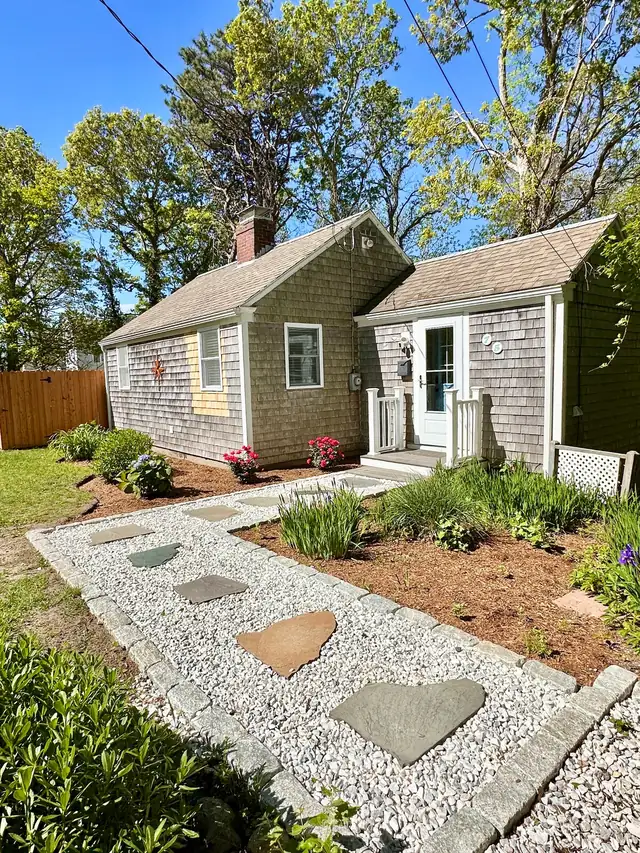 The Twin Cottages: both cottages with the stone garden walkway